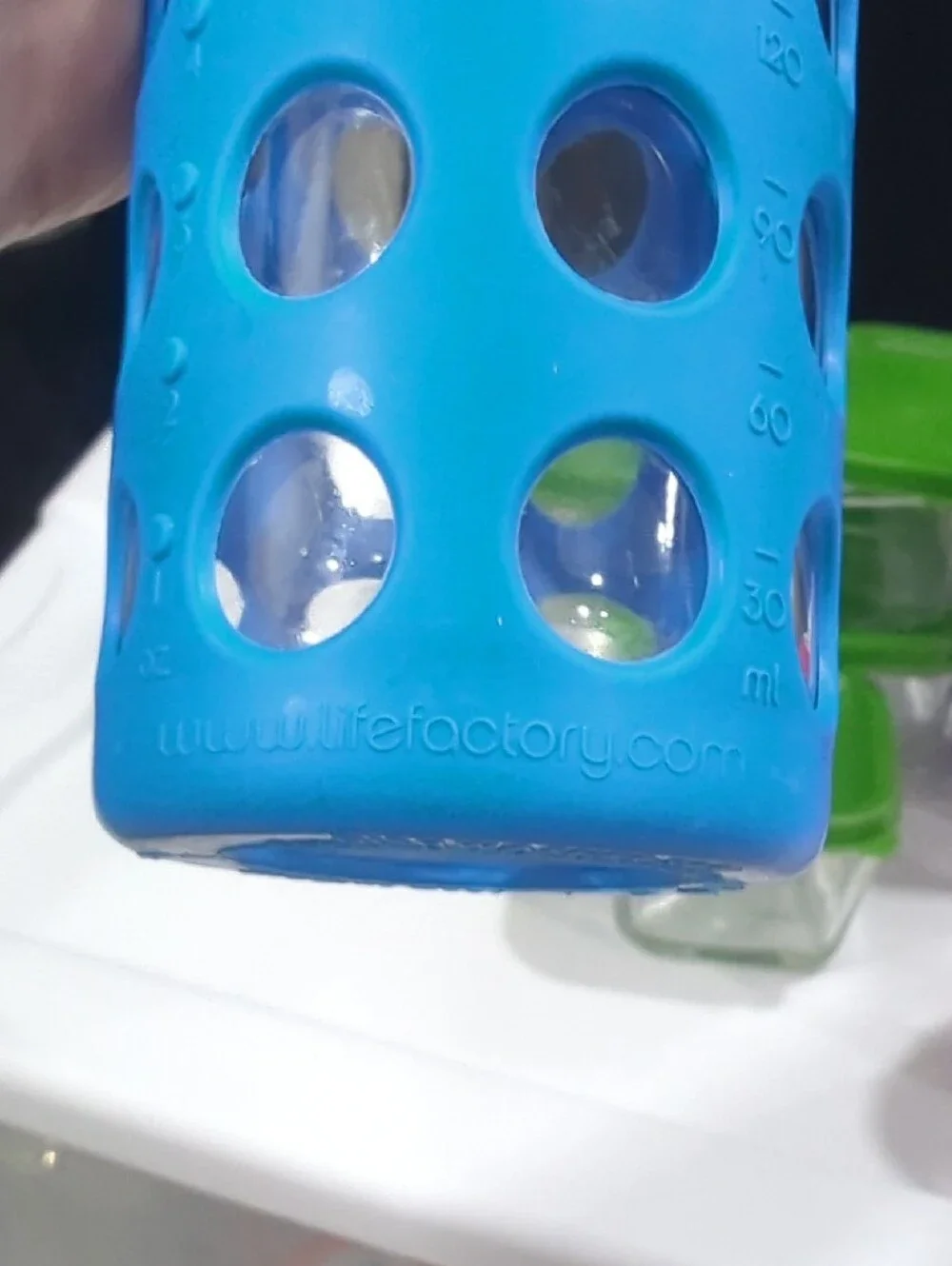 Glass Food Storage Set with Green Lids and Assorted Silicone Bottles
